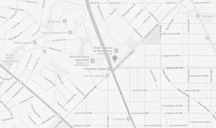 Street map showing business location with roads, landmarks, and nearby buildings in light gray tones